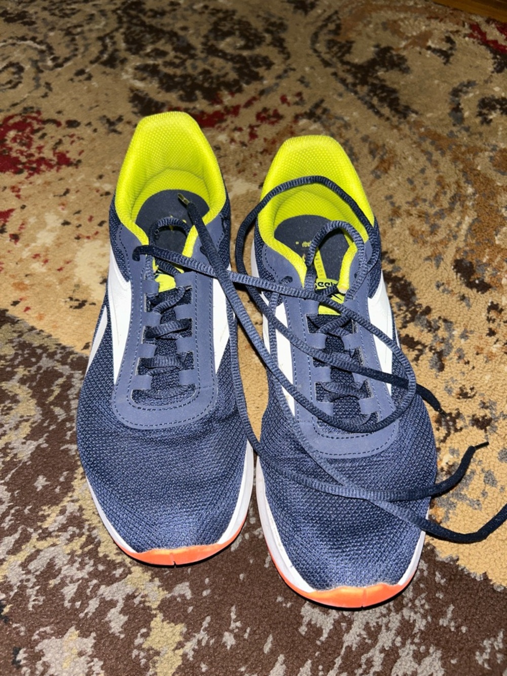 Reebok athletic shoes in a dark blue and yellow Sneakers with Neon Yellow Lining